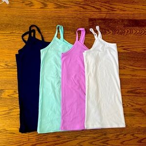 Four rib knit tank tops with spaghetti straps.